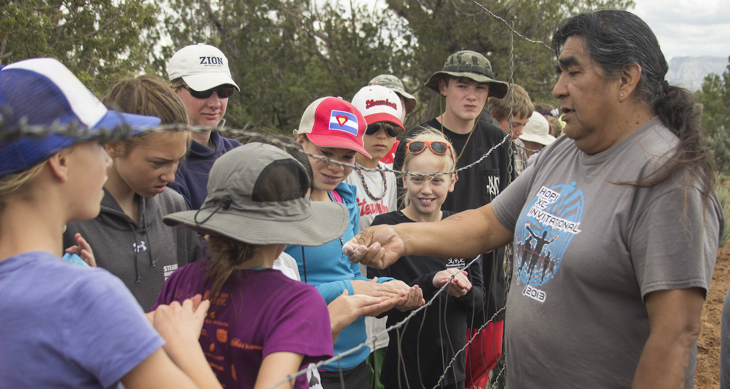 A Hopi farmer teaching a group of children about Hopi maize.